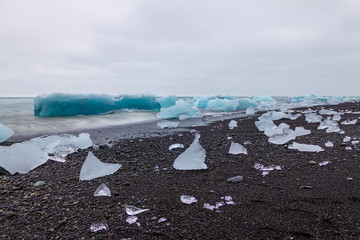 Ice on the beach, black sand, Jökulsárlón lagoon Iceland