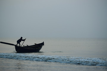 fishing boat in sea at dawn