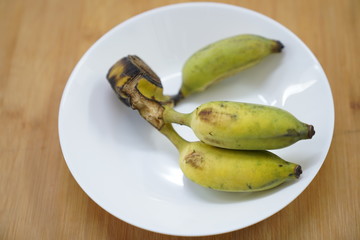 banana on white dish