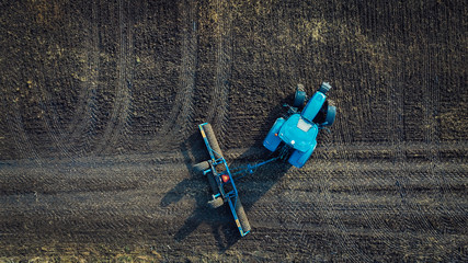 Land cultivation. Tractor in the field preparing the land for sowing