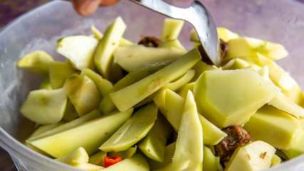 Sweet mango pickle mixed with sour plum and chillies slices.