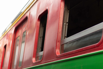 The side corner of the train window is parked at the station platform