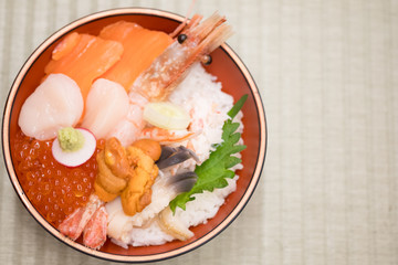 Fresh raw seafood mixed rice bowl (Kaisen-don, Japanese tasty food).