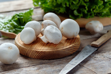 Raw mushrooms with rustic background