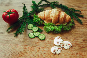 croissant with tomato cheese and mushrooms