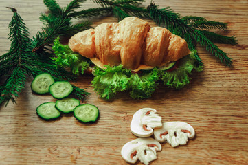 croissant with tomato cheese and mushrooms