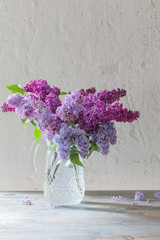 bouquet of lilacs in a glass jug