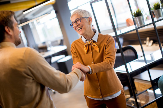 Grateful Senior  Businesswoman  Boss Lady Hold Hand Of Best Employee