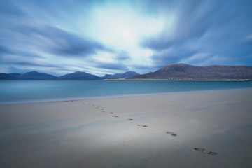 foot prints on the sandy beach