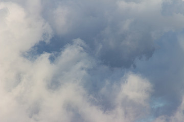 Fototapeta na wymiar Fluffy cloud close-up detail photo, high contrast