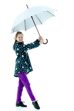 Cute little girl with umbrella. Weather forecast concept.