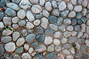 An old pebblestone road cobbled with natural stones