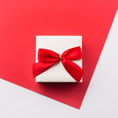 Present white gift box with red bow