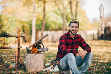 Outdoor portrait of a young countryman on autumn day. - obrazy, fototapety, plakaty