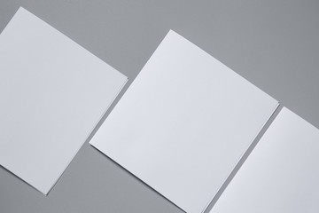 Blank portrait mock-up paper. brochure magazine isolated on gray, changeable background / white paper isolated on gray