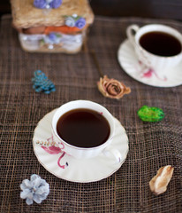 A cup of tea on a decorated table. Tea time