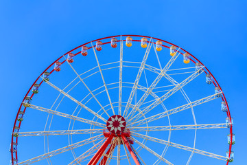Big ferris wheel against the blue sky