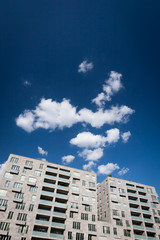 Modern apartment block. A generic contemporary high rise apartment block offset blue sky copy space.