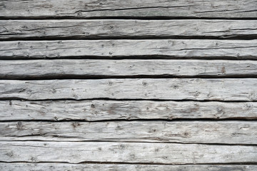 gray weathered wooden wall from logs