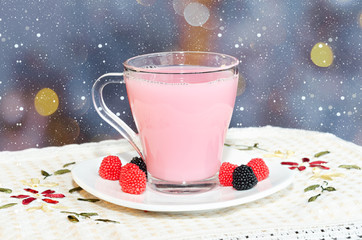 Christmas or New year non-alcoholic cocktail with berries and cream for children. Festive bokeh background