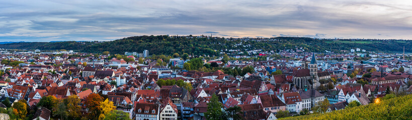 Fototapeta premium Germany, XXL panorama view over houses, st dionysius church, roofs and skyline of medieval city esslingen am neckar at sunset in colorful autumn mood