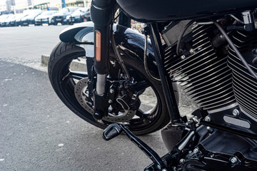 Fototapeta na wymiar front of the motorcycle, wheel, disc brakes closeup