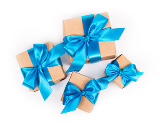 Gift boxes on white background. Gifts with blue bows. Gift boxes top view
