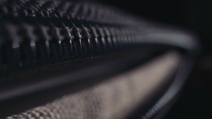 Zipping up backpack / laptop case, close up macro