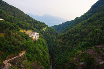 View from the Contra Dam over a hydroelectric power plant in Ticino, Switzerland