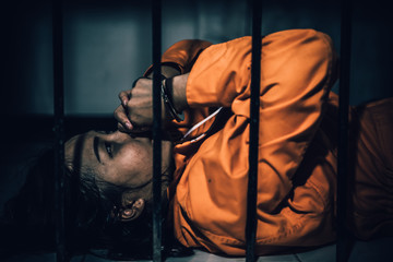 Portrait of women desperate to catch the iron prison,prisoner concept,thailand people,Hope to be...