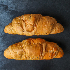 croissant bun (delicious fresh pastries, sandwich roll) menu concept. food background. top view. copy space