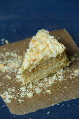 homemade Napoleon cake with cream on a gray background