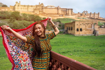Woman posing at Amber Fort near Jaipur in Rajasthan, India