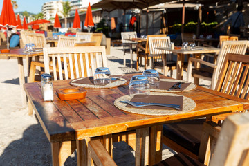 A table in a restaurant on the beach. Luxury resort. Close-up.