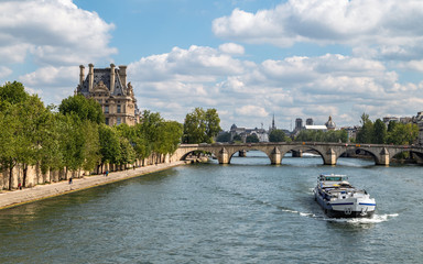 Beautiful view of riverside of Seine river in a spring sunny day. Scenery of Paris, France