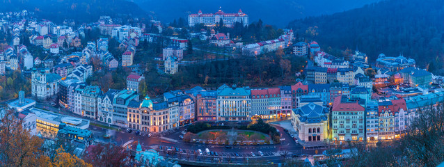 Obraz na płótnie Canvas View to Karlovy Vary city from above at sunset 