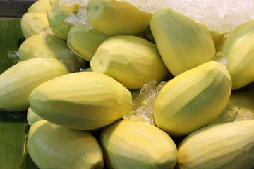 Peeled raw mango and frozen in ice