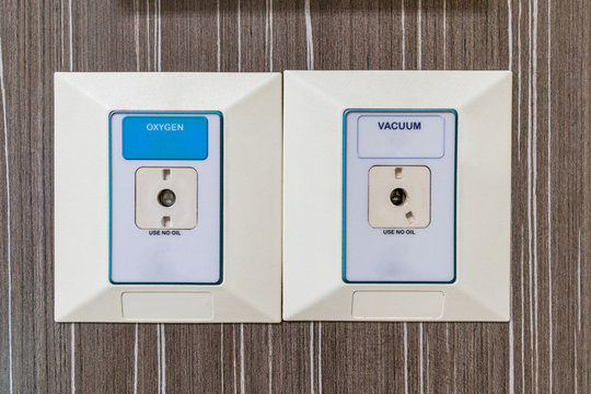 Medical oxygen and vacuum plug sockets port in hospital, health and care concept.