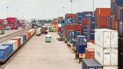 Logistics operation in railroad container yard with zoom out technique timelapse - Powered by Adobe