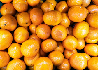 group of fresh orange fruit sell in market thailand. vitamin C from natural vegan food.