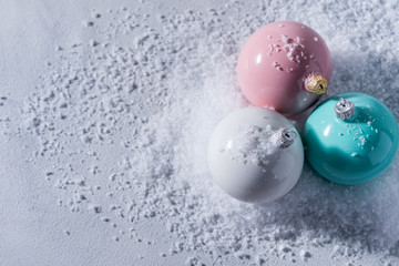 color christmas balls on a snow background