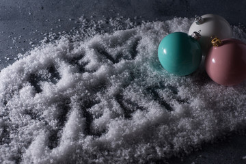 color christmas balls on blue snow background