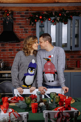 pregnant wife with husband in the kitchen