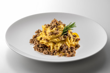 Elegant White round bowl with tagliatelle Bolognese