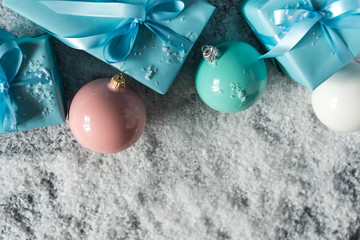  Christmas gifts and New Year decorations and balls on the snow