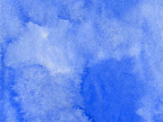 Blue watercolor texture. Abstract hand painted background. Sky blue stains on paper