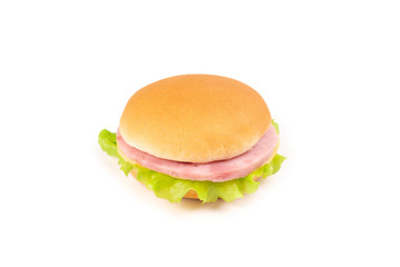 Sandwich with ham, cheese, lettuce on white background.