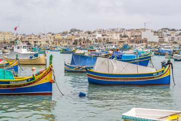 Fototapeta na wymiar Marsaxlokk is a picturesque fishing port on the island of Malta.