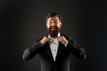 Classic and fashionable. Happy groom fix fashionable bow tie. Bearded man in fashionable prom style. Fashionable look of vogue model. Prom and wedding attire. Fashion and style