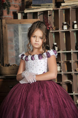 Vintage portrait of little girl in purple dress